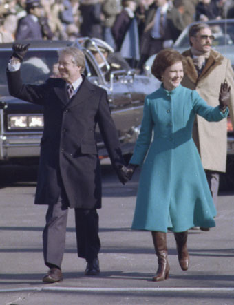President Carter holding hands with Rosalyn Carter and waving