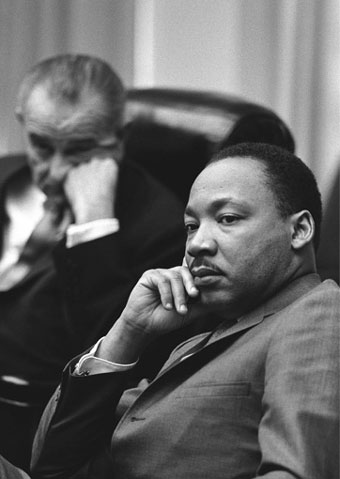 Martin Luther King Jr. with Lyndon Johnson in the background