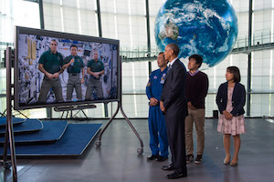 Obama watches space station video