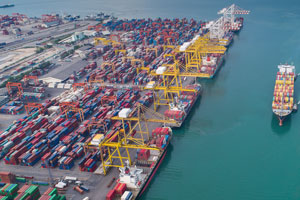 Containers at a port with ship in background