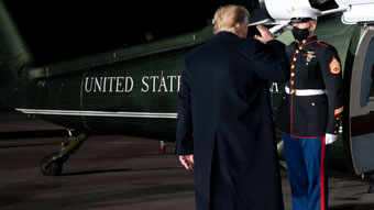 Donald Trump salutes marine as he boards helicopter
