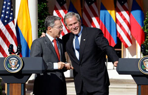 President George W. Bush shaking hands with President Uribe of Colombia