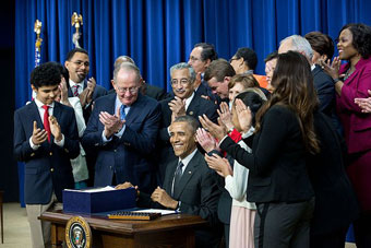 President Obama signing a bill