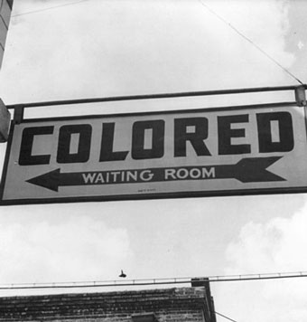 "Colored" sign with an arrow