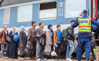 Immigrants board a train