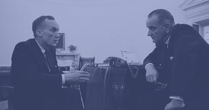 Tom Mann and President Johnson talk to each other at desk