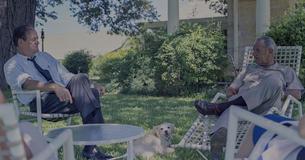 LBJ and Hubert Humphrey sitting in chairs outside