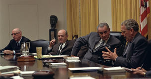 Richard Russell, Dean Rusk, Lyndon Johnson, Clark Clifford around a table