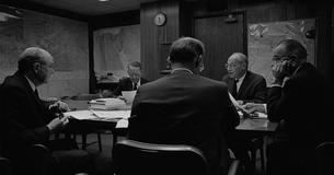 LBJ and advisors sitting around a table