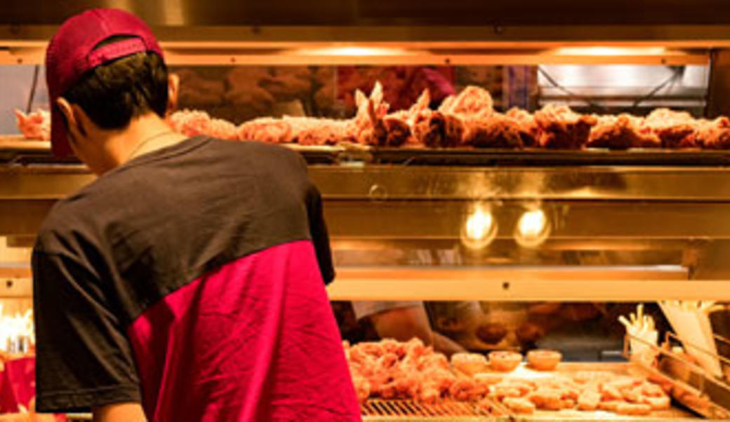 Worker in fast food restaurant