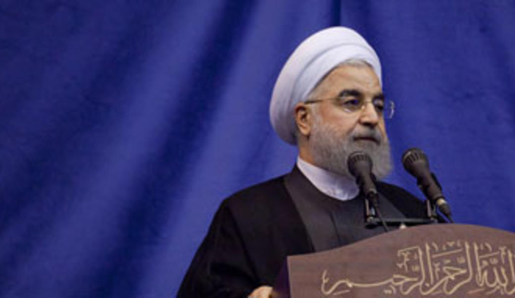 Hassan Rouhani against blue curtain