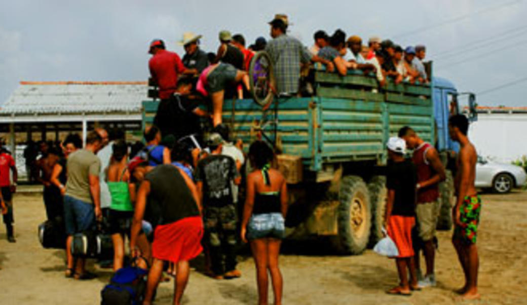 Immigrants getting onto a truck