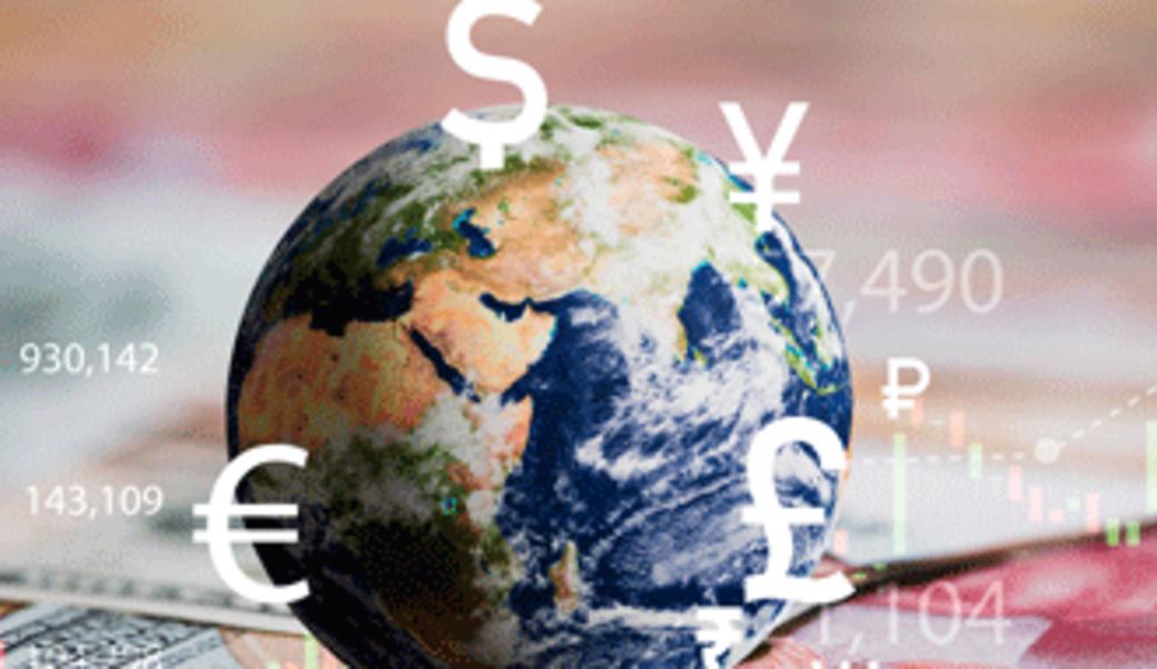 Globe and signs for currency around the world