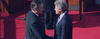 George H. W. Bush and Bill Clinton shake hands at Clinton's 1993 inauguration